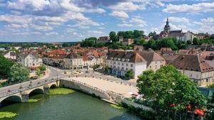 a city with a bridge over a river at Studio Sittelle in Gray