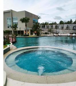 a large pool of water in front of a building at Aqualand Resort in Salinópolis