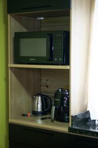 Afbeelding uit fotogalerij van Chalet Henz in Bom Princípio in Bom Princípio +21 foto's