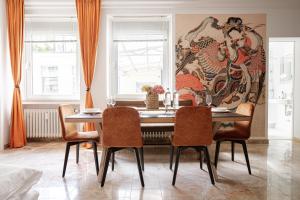 a dining room with a table and chairs at Little Japan in Düsseldorf