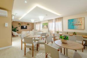 TV a/nebo společenská místnost v ubytování Condo. c/ Piscina e Academia a 70m da Praia - SMA