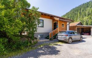 a house with a car parked in front of it at Gästehaus Kerber in Steeg