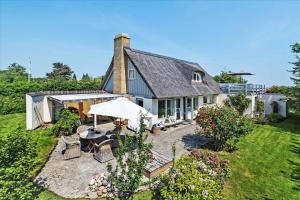 an aerial view of a house with an umbrella at 30508-Odder-Dyngby-Havvej-42 in Odder