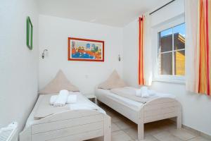 Postel nebo postele na pokoji v ubytování Grachtenstube