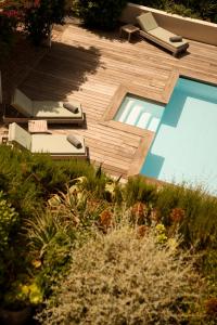 an overhead view of a backyard with a swimming pool at L'Hostellerie du Moulin des Oliviers in Olmeto