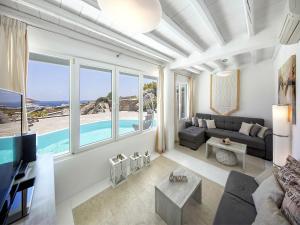a living room with a view of the ocean at Villa in Mykonos with Sea View and Pool in Kalafatis