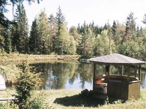 a small gazebo in front of a lake at 6 person holiday home in RYSSBY-By Traum in Agunnaryd