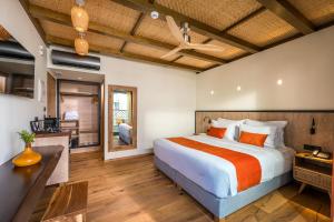 a bedroom with a king sized bed and a desk at Artion City Boutique Hotel in Heraklio