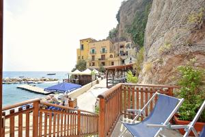a balcony with chairs and a view of the ocean at Casa della Marina - beach, seaview, wifi in Conca dei Marini