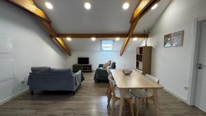 a living room with a table and a couch at S'apartments in Leiria