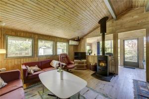 a living room with a couch and a table at 30312-Odder-Lyngbakkevej-29 in Odder