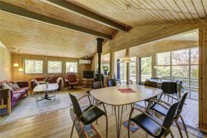 a living room with a table and chairs at 30312-Odder-Lyngbakkevej-29 in Odder