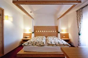 Postel nebo postele na pokoji v ubytování Hotel Gran Mugon