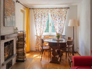 a living room with a table and a window at Lovely Flat in Morgex in Morgex