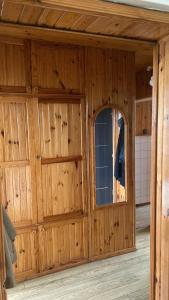 a wooden garage with a door and a window at Katedralna 3a apartment in Chełm