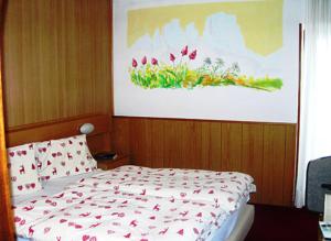 Postel nebo postele na pokoji v ubytování Hotel Gran Mugon