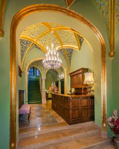 an archway in a room with a chandelier at Heritage Boutique Hotel Sighisoara in Sighişoara