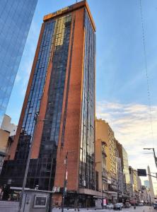 a tall red brick building on a city street at Tango BA 2 in Buenos Aires +3 photos