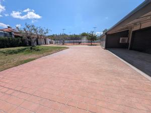a brick walkway in front of a building at Stay Padel House in Perpignan