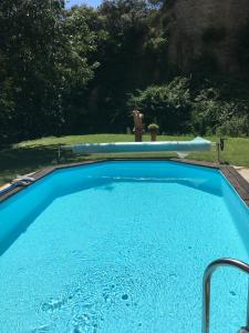 a large swimming pool with a large at Chambres D'hôtes Le Mas Aux Arômes in Puget