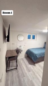 a small room with a bed and a sink and a desk at Nisay Home - Apart Hotel - 3 Room Apartment - N3 in Ludwigsburg +22 photos