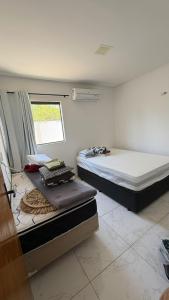 Postel nebo postele na pokoji v ubytování Casa aconchegante com piscina e área gourmet