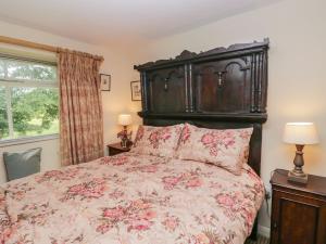 En eller flere senge i et værelse på The Laundrymaid's Cottage