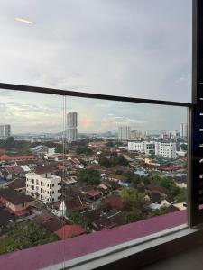 a view of a city from a window at Malacca Town TrendCove Homestay in Melaka