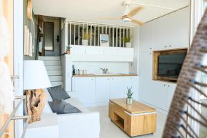 a living room with a couch and a table at Duplex Cocon & Vue Mer Imprenable in Arcachon