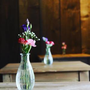 a vase filled with flowers sitting on a table at The Helyar Arms in Yeovil