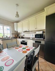 a kitchen with a table with food on it at Casa Esperança in Albufeira