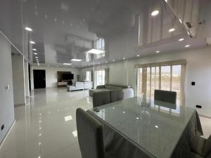 a large living room with a table and chairs at Jhonny Cay Collection Apartahotel in San Andrés