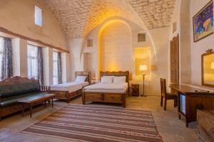 Ένα ή περισσότερα κρεβάτια σε δωμάτιο στο PALMYRA BOUTIQUE HOTEL