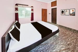 Ένα ή περισσότερα κρεβάτια σε δωμάτιο στο Hotel O Royal Heritage Resort