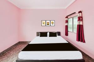 Ένα ή περισσότερα κρεβάτια σε δωμάτιο στο Hotel O Royal Heritage Resort