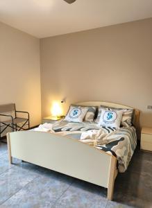 Giường trong phòng chung tại SG Family - Sirmione Lido