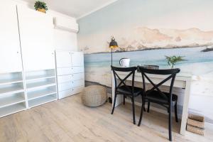 a dining room with a table and two chairs at Nolana hotel in Taltal