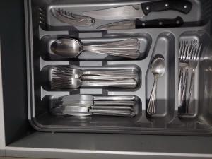 a drawer filled with forks and spoons and utensils at Favorite Family Flat in Bila Tserkva