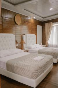 Postel nebo postele na pokoji v ubytování Simpang 4 Homestay