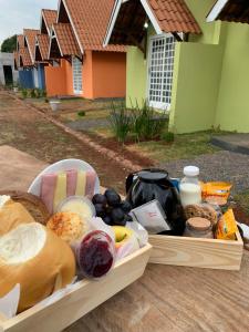 a tray of food sitting on top of a table at Chalés no Quintal in Alvorada do Sul +20 photos
