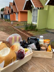 a tray of food sitting on top of a table at Chalés no Quintal in Alvorada do Sul