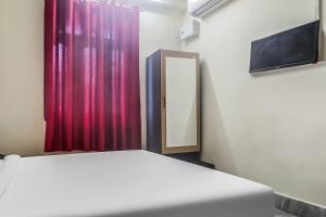 Postel nebo postele na pokoji v ubytování Hotel O Maharaja Galaxy + 22 fotografií