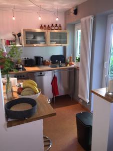 a kitchen with a bowl of bananas on a table at Garten86 in Bremen