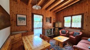 a living room with a couch and a table at Nevi Apartment in Folgarida