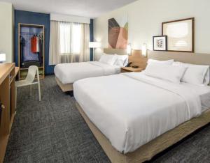 a hotel room with two large beds and a desk at Spark by Hilton Matteson Chicago I 57 in Matteson