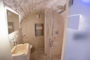 a bathroom with a shower and a sink at Pregio Villas per Suite Oronzo Charme&Pool in Ostuni