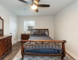a bedroom with a bed and a ceiling fan at Family Retreat with NEW POOL - Durham Upstairs Unit in Durham +21 photos