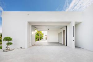 an empty hallway of a white building at Luxury Modern Villa Phuket - Thala in Phuket