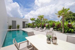 an image of a villa with a swimming pool at Luxury Modern Villa Phuket - Thala in Phuket