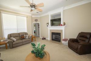 a living room with two couches and a fireplace at Farmhouse Charm in College Station